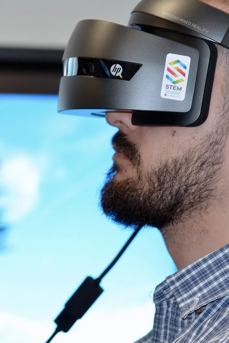 User wearing a VR headset during a design review